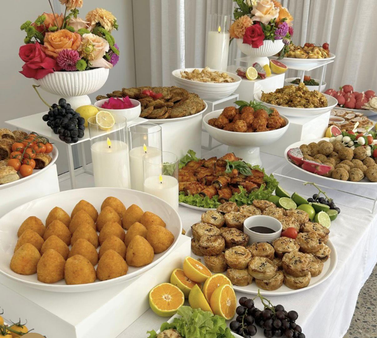 Beautifully styled banquet table with deep linens, gold cutlery and seasonal South African plating
