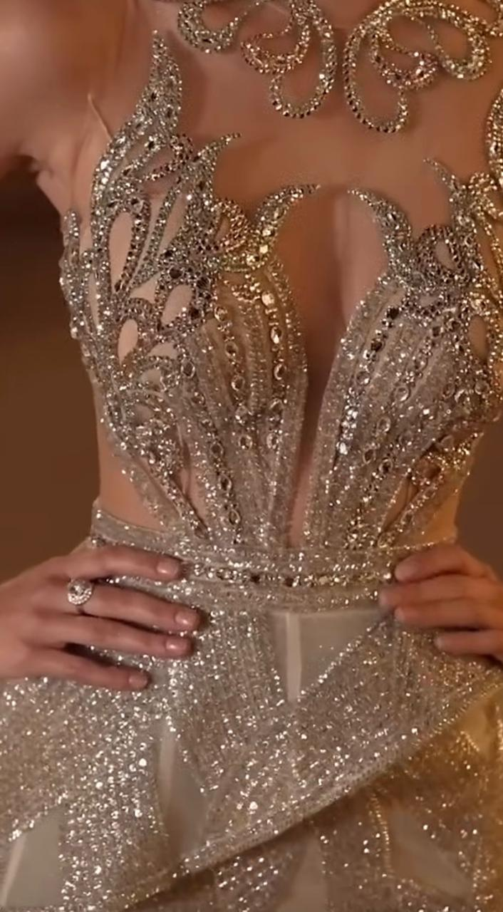 Close-up of a hand-beaded crystal couture bodice in champagne and gold, designed by Designer DK for Shaddai Designs
